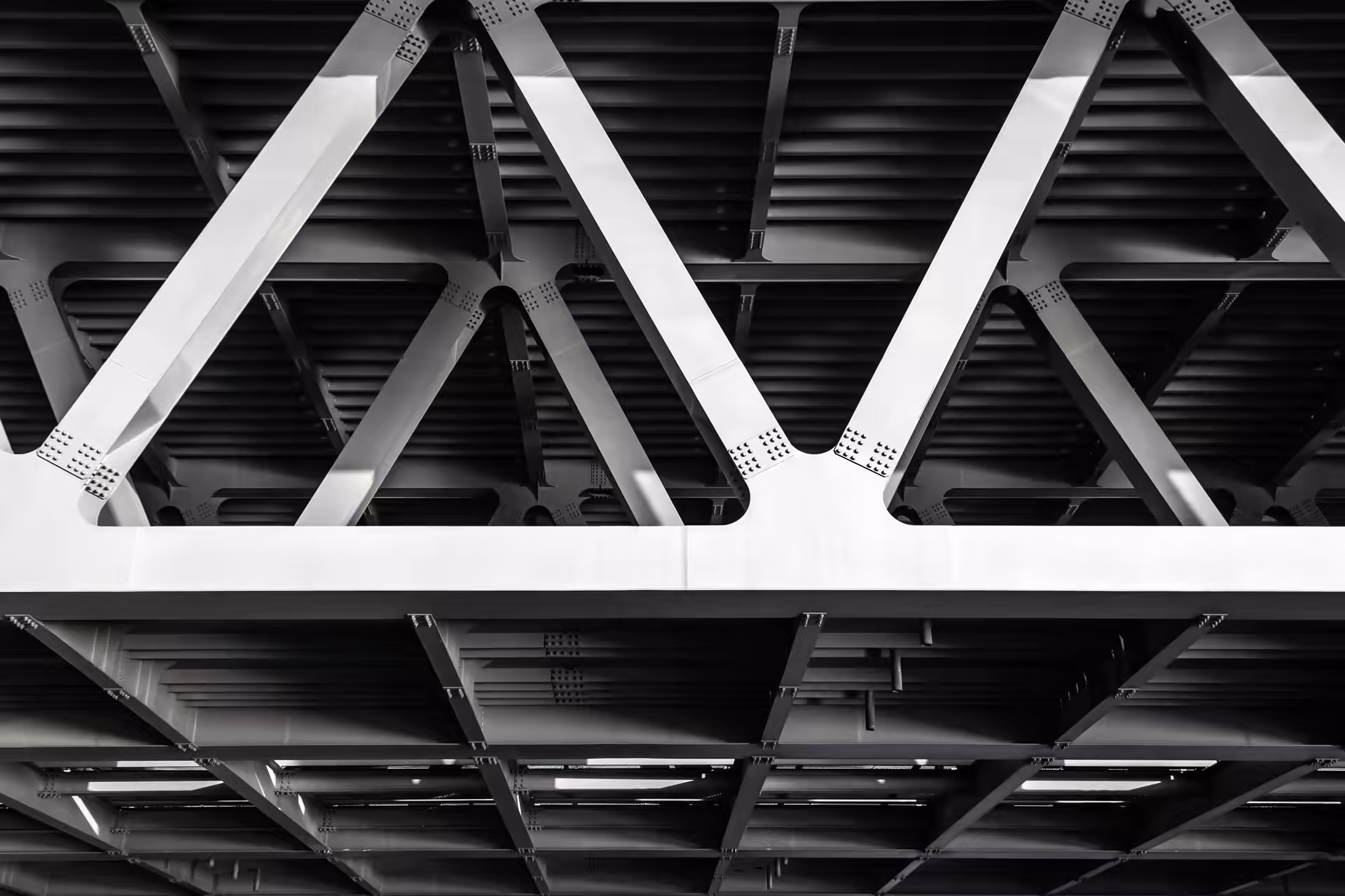 Grey steel lattice framework of a bridge structure