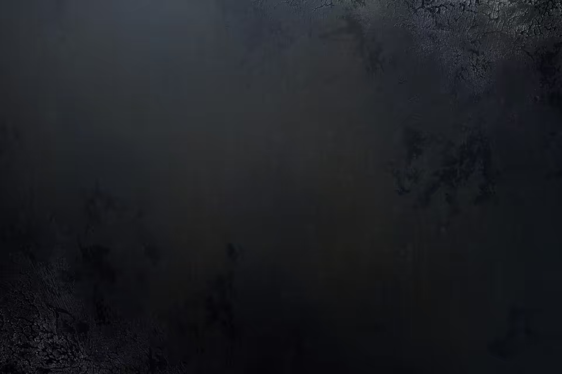Dark abstract surface in layered shades of black