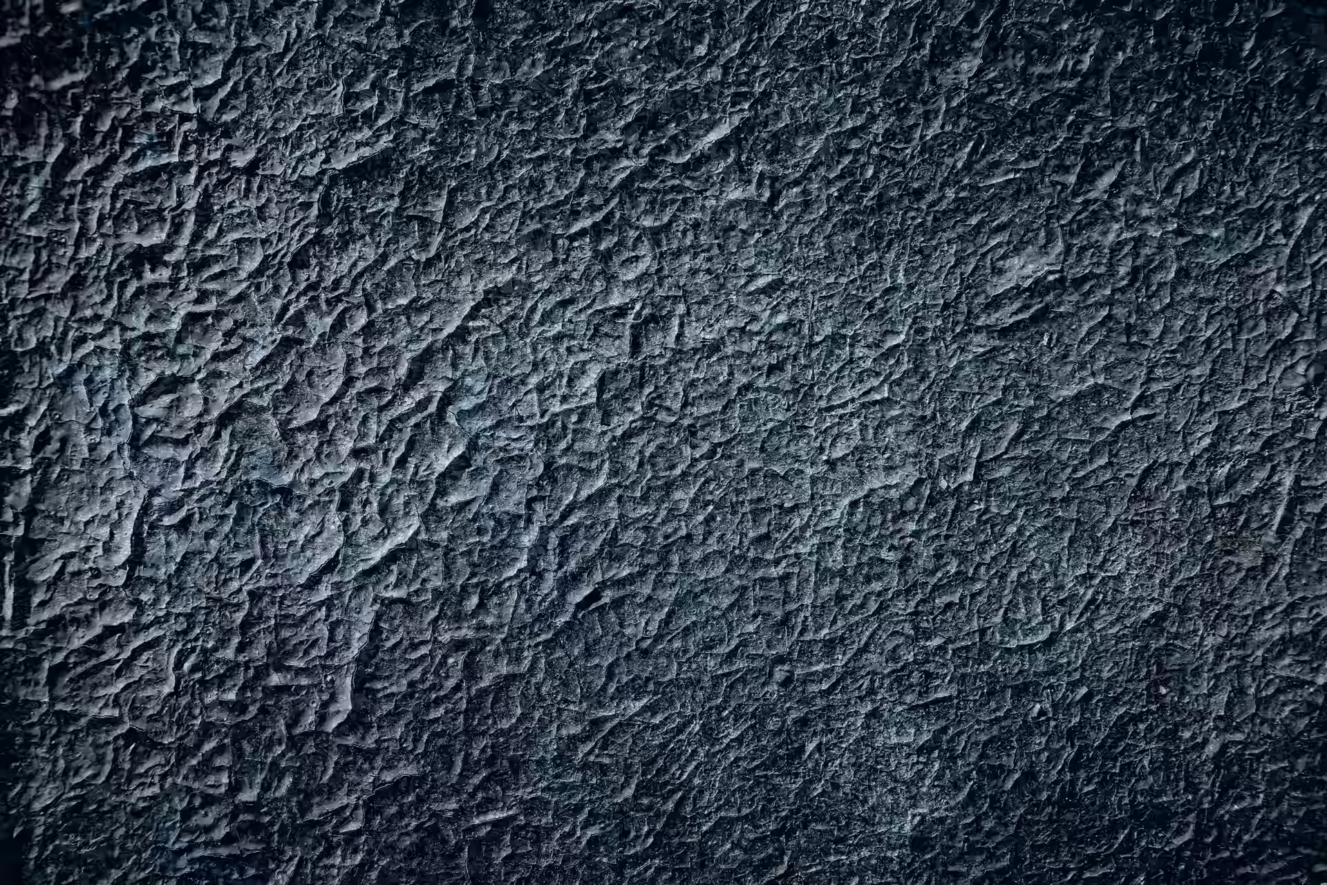 Textured blue and black mineral surface